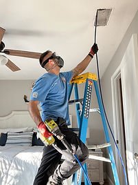 Technician performing air duct cleaning in Jacksonville, FL