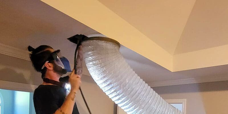 E.R HVAC technician preparing to work in a Jacksonville home